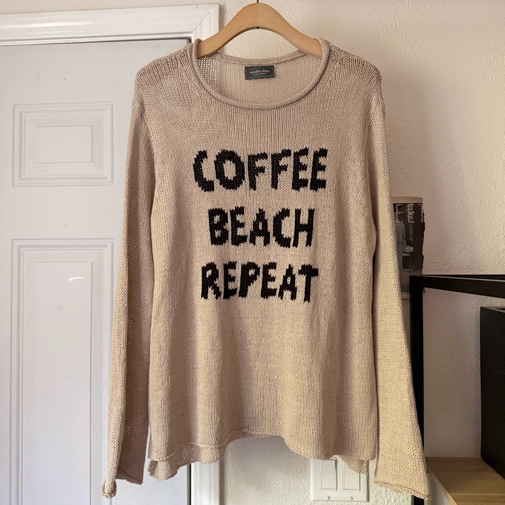 Beige Sweater with Black Text
